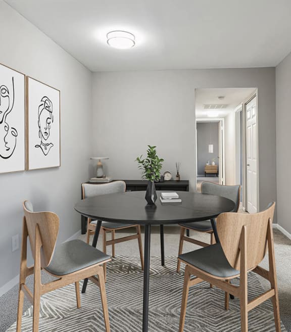 Model Dining Room with Carpet and View of Kitchen at Spring Parc Apartments in Silver Spring, MD-SMLAM.
