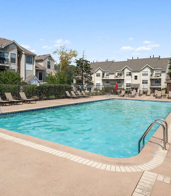 Community Swimming Pool with Pool Furniture at Fox Valley Villages Apartments located in Aurora, IL-SMLAM.