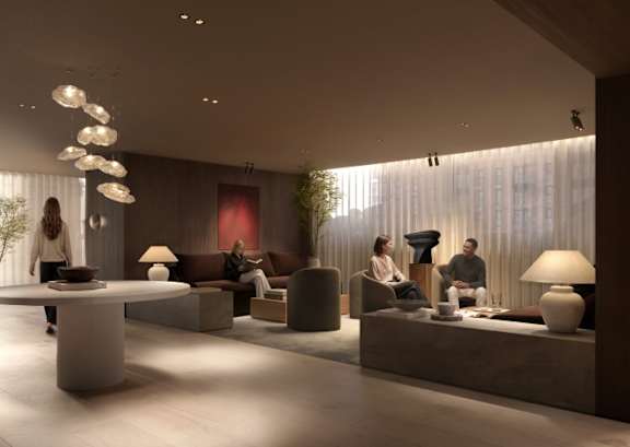 A modern kitchen with a bar area and a dining table set up.
