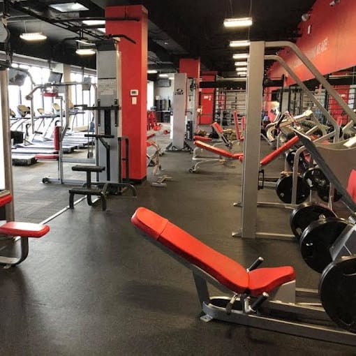 a gym with a bunch of exercise equipment in it