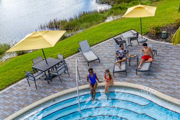 People enjoying near pool at Portofino Vineyards, Fort Myers, Florida