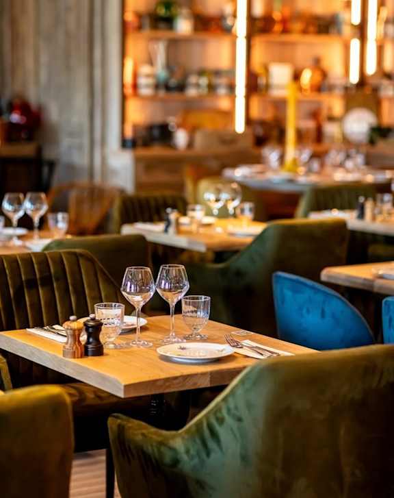 A restaurant with tables set for dining.
