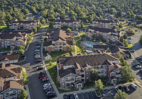 an aerial view of a neighborhood with houses and cars parked