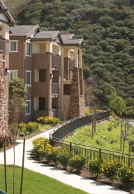 a woman sitting on a chair in a window