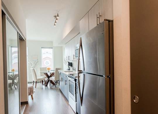 Seattle Apartments - Icon Apartments - Entryway, Kitchen, and Dining Room at Icon Apartments, Seattle, WA, 98104