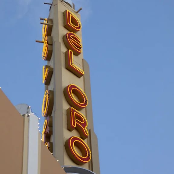 A tall building with a sign that says "DELUXE".