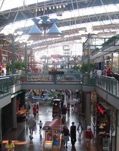 a large shopping mall with people walking around it