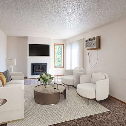 a living room with white furniture and a fireplace.Fargo, ND Westview Towers Apartments
