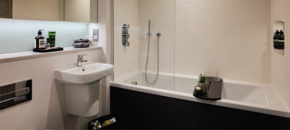 a bathroom with a sink toilet and a bath tub