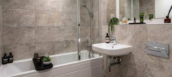 a bathroom with a sink toilet and a tub