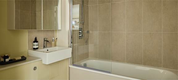 a bathroom with a sink toilet and a tub