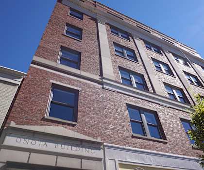 a brick building with a sign that reads building