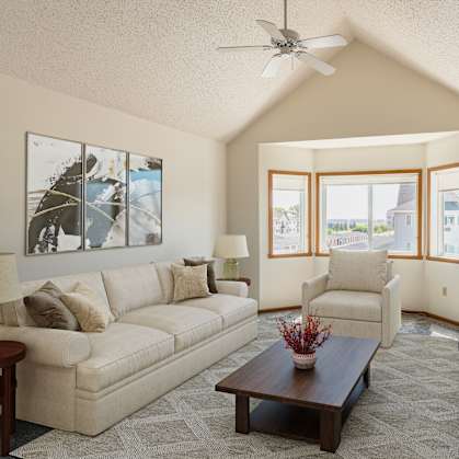 Fargo, ND Bayview Apartments. A living room with a vaulted ceiling and a large window