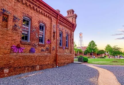A brick building with a water tower in the background.