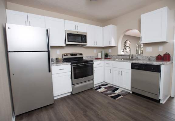 A kitchen with white cabinets and a refrigerator at Ridge Crossings Apartments, Hoover, 35244