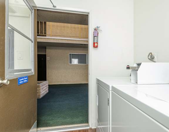 a laundry room with a washer and dryer
