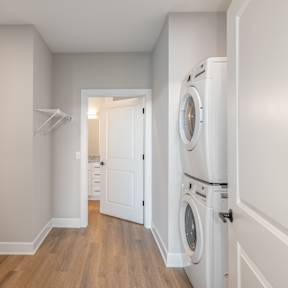 A laundry room with a washer and dryer in it.