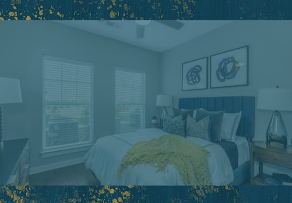 a bedroom with a bed and two windows