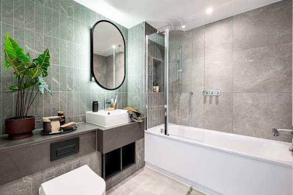 A bathroom with a white sink and a white bathtub.