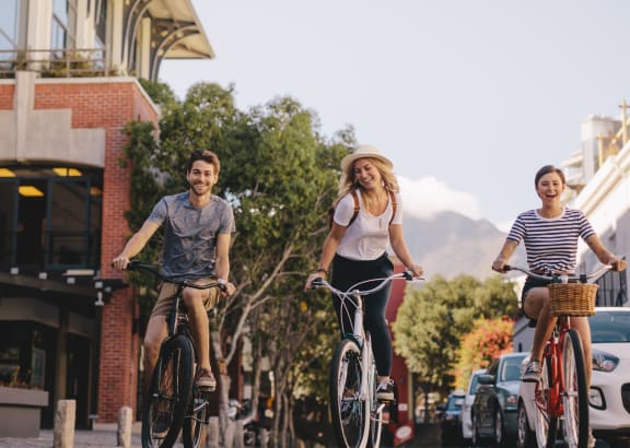 Friends riding bikes around the city