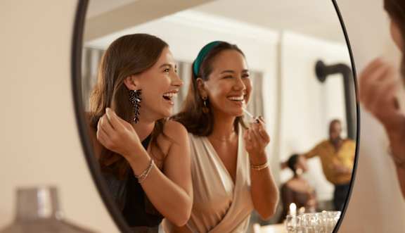 Two women are looking at each other in a mirror at The Foundry Apartments, Bordon, GU35 9FE