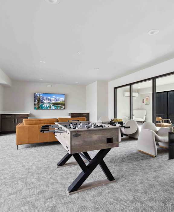 A modern kitchen with wooden floors and a large island.