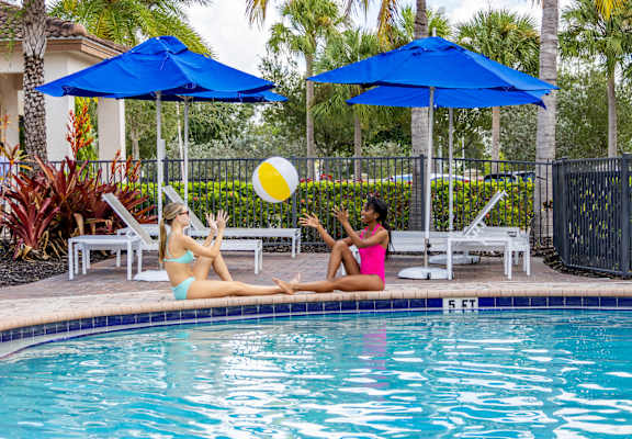 Two women playing by the pool at Portofino Cove, Fort Myers, FL, 33916