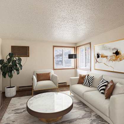 a living room with couches and a table. Fargo, ND Cedar Pointe Apartments