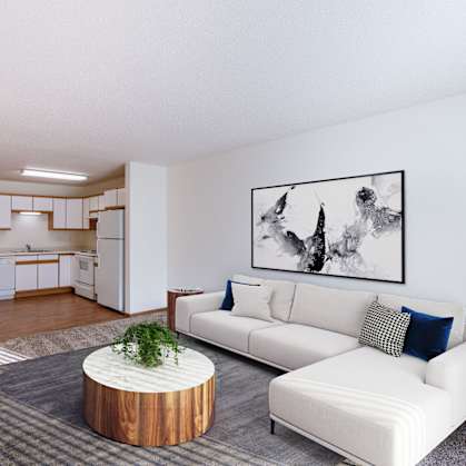 a living room with a white couch and a table