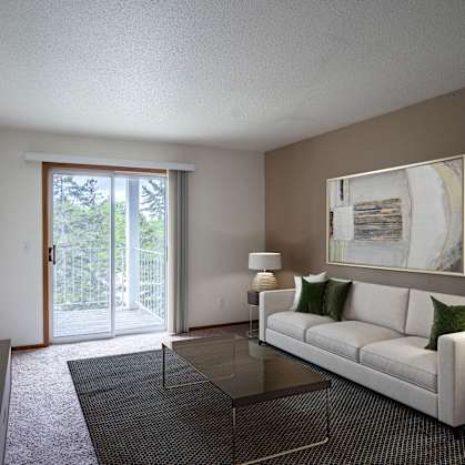 a living room with a white couch and a glass table. Fargo, ND Briar Pointe Apartments