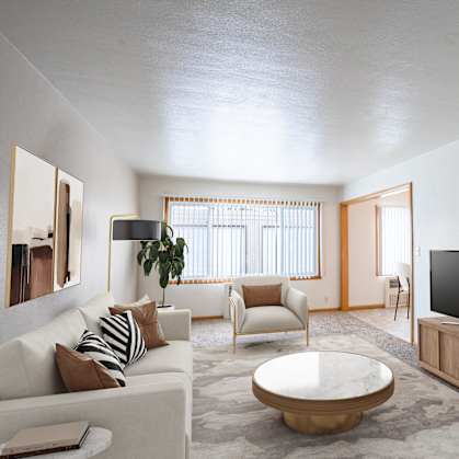 A modern living room with a white couch,  coffee table, and a television. Fargo, ND L&R Apartments