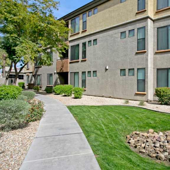 Green spaces and paths at Bolero Apartments.