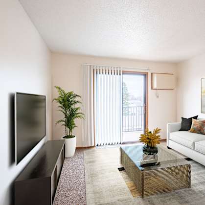 A living room with a white couch, a flat screen TV, a coffee table, and a painting on the wall. Fargo, ND Hawthorn Apartments