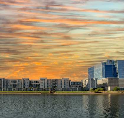 a city with a lake in front of it