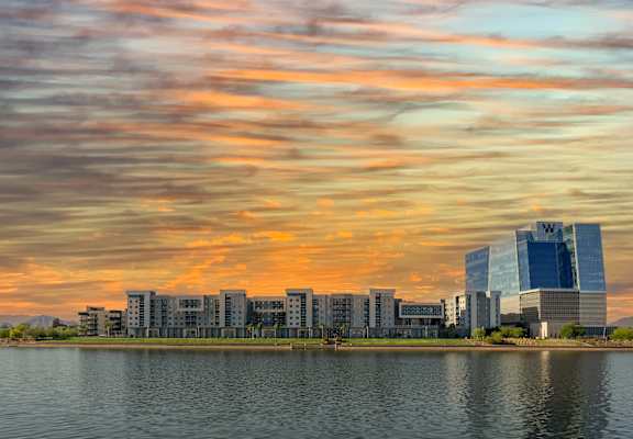 a city with a lake in front of it