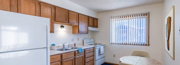 Grand Forks, ND Chandler 1898 | a pile of bath towels and a soap dispenser with lavender on a counter