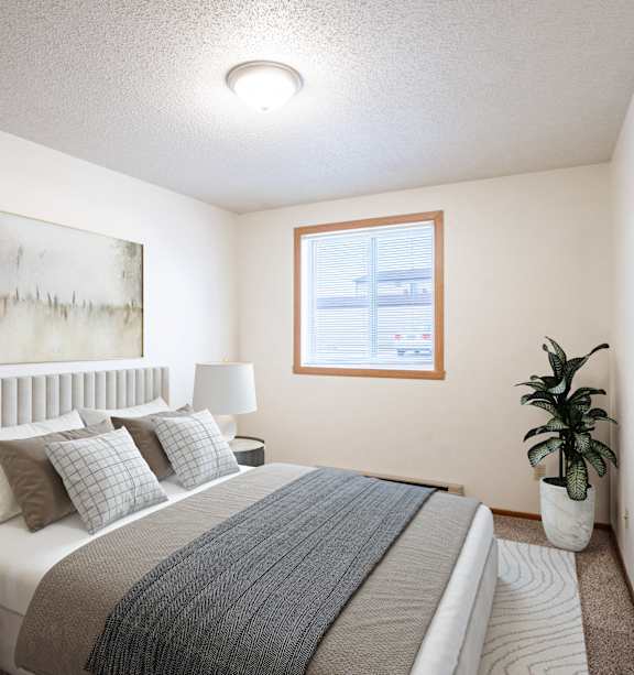 Fargo, ND Candlelight Apartments | 11B | Bedroom a blue building with a lawn and a fire hydrant in front of it