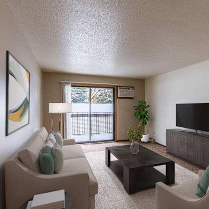 a living room with a couch and a coffee table and a tv