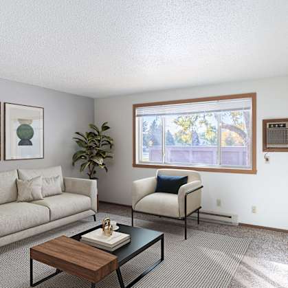 a living room with a couch and a table and a window. Fargo, ND Pacific Park Apartments