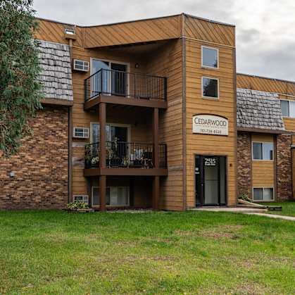 Grand Forks, ND Cedarwood Apartments. The exterior of a three level apartments building