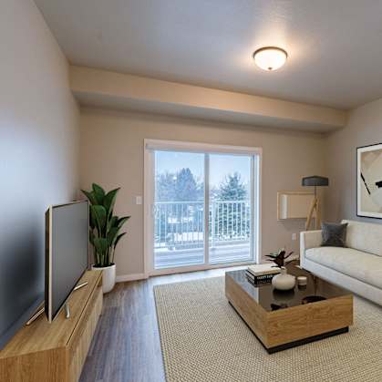 a living room with a couch and a coffee table. Fargo, ND Prairiewood Meadows Apartments