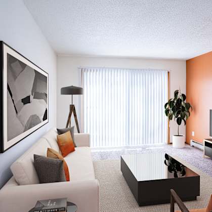 A living room with a white couch, a coffee table, a television, and a plant. Fargo, ND Carr Apartments