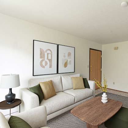 a living room with a couch and a coffee table. Fargo, ND Luxford Apartments