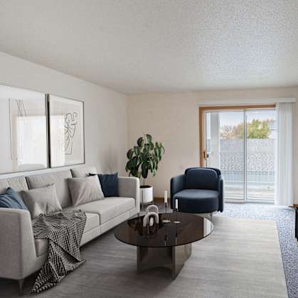 a living room with a couch and a coffee table. Fargo, ND Oxford Apartments