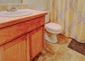 Thumbnail 13 of 15 - Image of bathroom with vanity, toilet, and bathtub