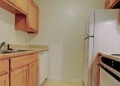 Thumbnail 10 of 15 - Image of kitchen with cabinets and appliances