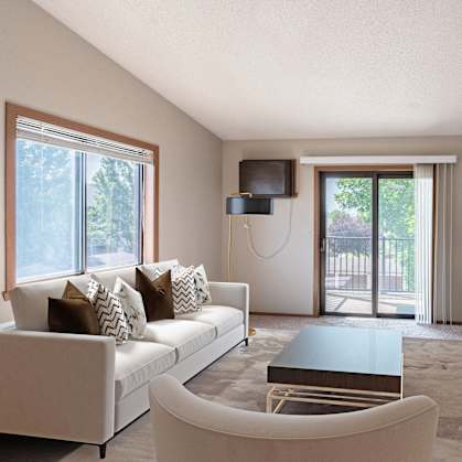 a living room with a couch and a coffee table and a tv. Fargo, ND Rosegate Apartments