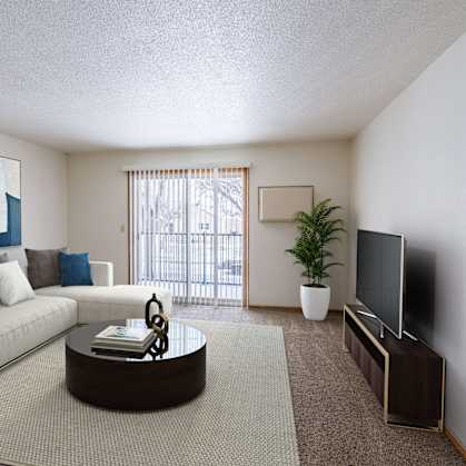 a living room with a couch and a coffee table. Fargo, ND Schrock Apartments