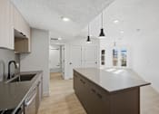 Thumbnail 2 of 51 - Kitchen with Island at Brickside Heights, Millcreek, UT