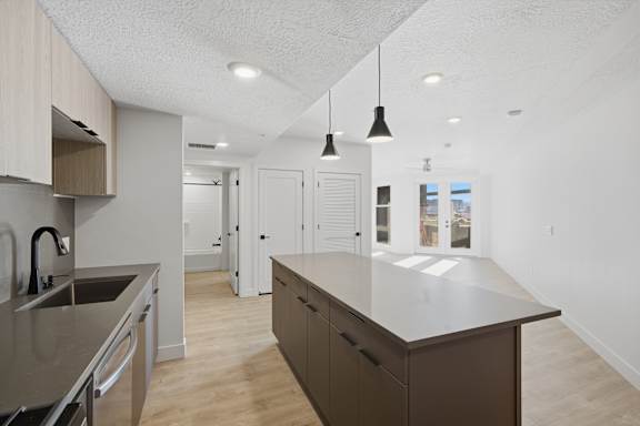 Kitchen with Island at Brickside Heights, Millcreek, UT